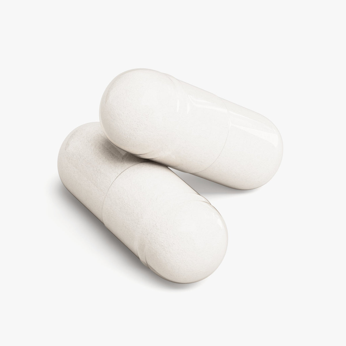 Two capsules of Magnesium Glycinate on a white background, representing a bioavailable magnesium supplement.