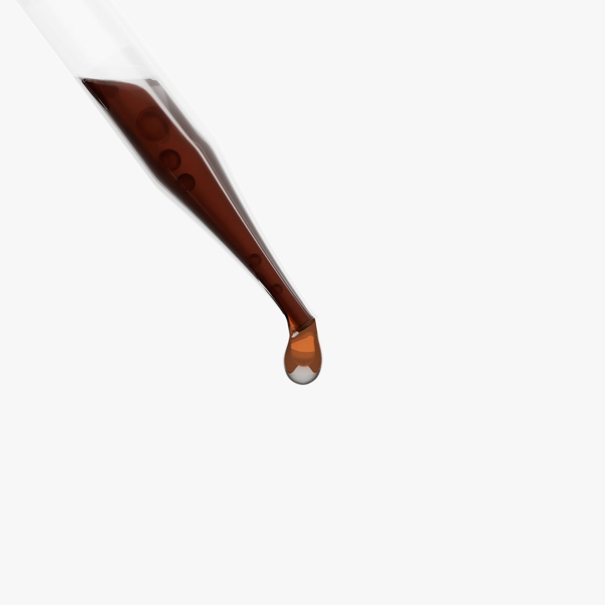 Droplet of Adaptogen Immunity Drops extracted from a dropper, showcasing the rich brown liquid.