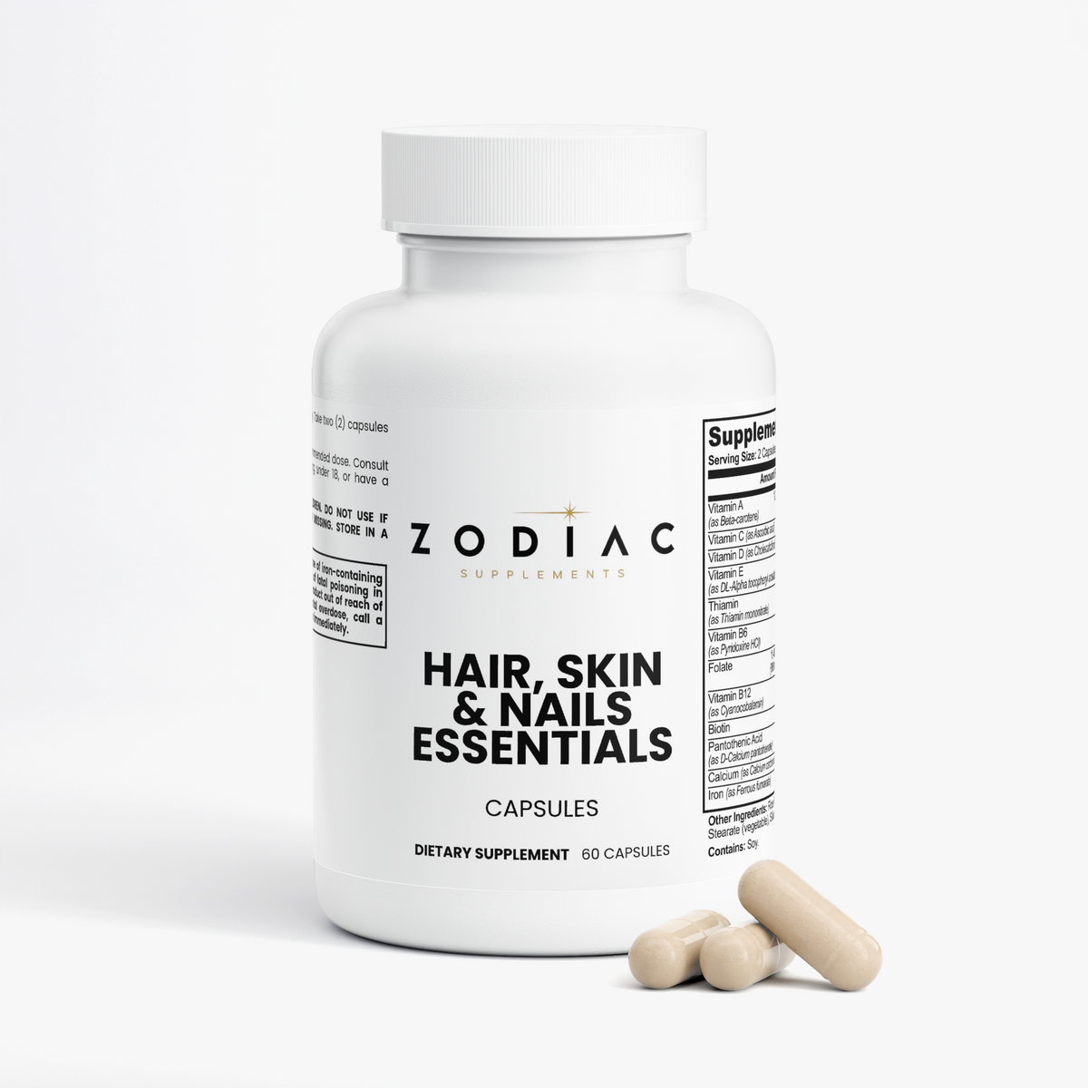 Hair Skin and Nails Essentials capsules bottle with dietary supplement information and two capsules beside it.