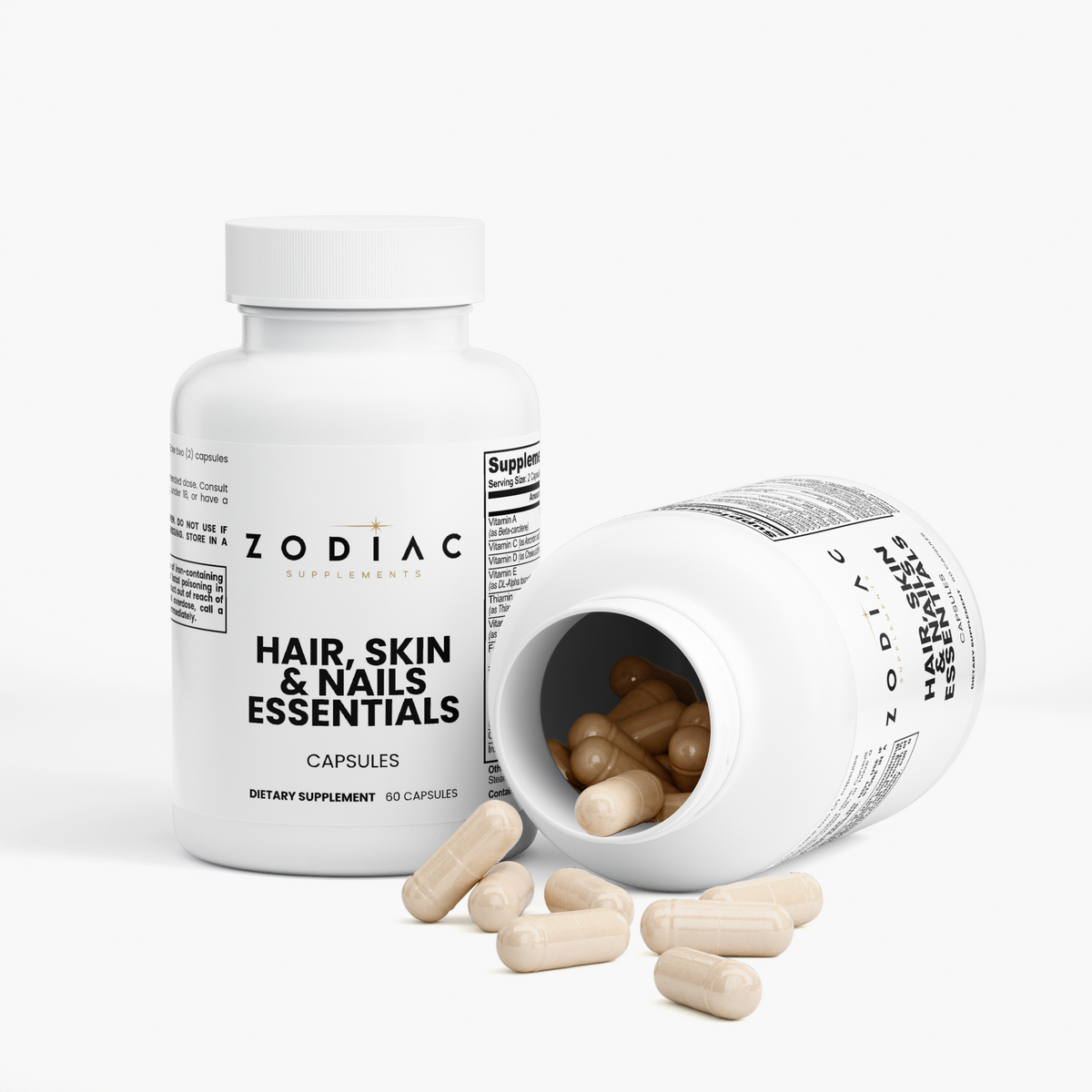 Hair Skin and Nails Essentials capsules bottle with spilled capsules, dietary supplement for hair, skin, and nail health.