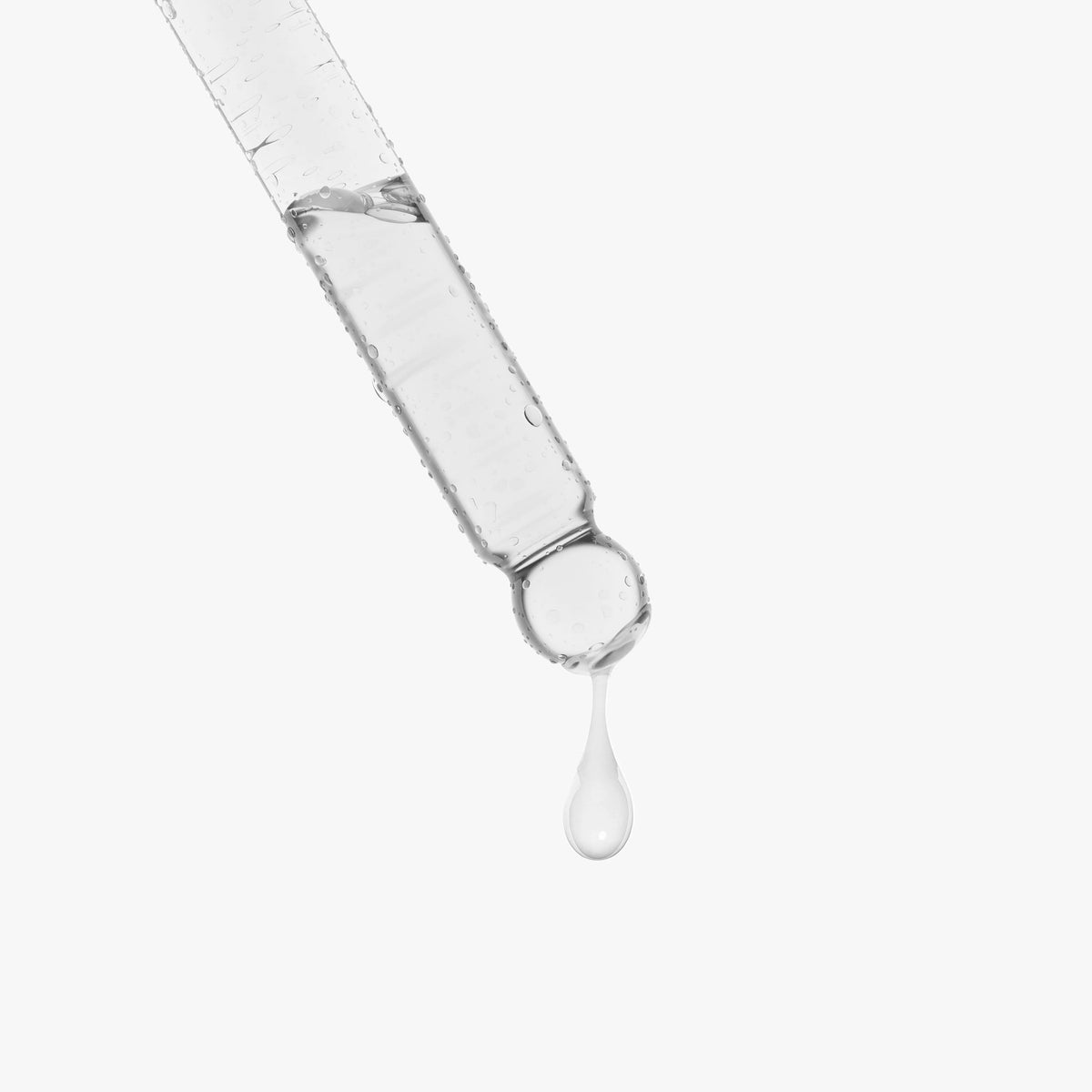 Drop of Snail Mucin Face Serum from a dropper for hydration and skin texture improvement