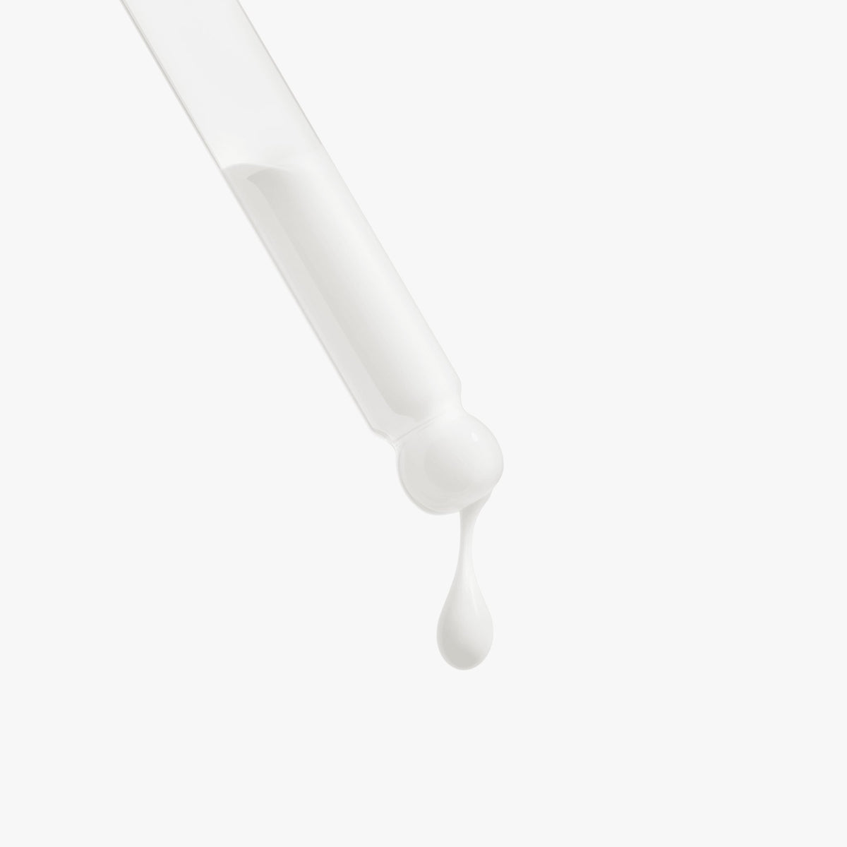 Dropper dispensing Retinol and Peptide Face Serum, a rejuvenating skincare product for smoother skin.